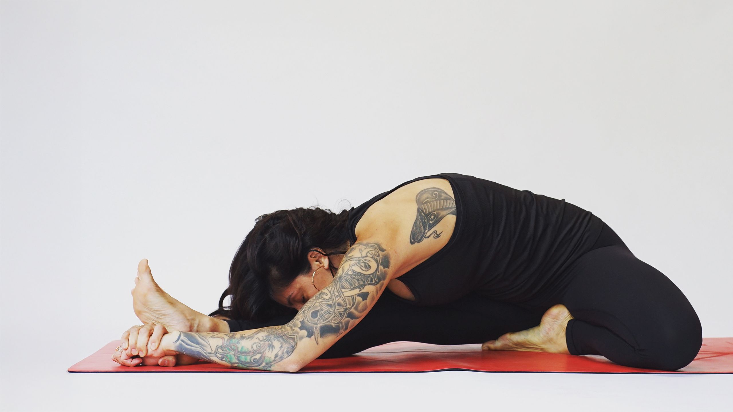 neda in a yoga pose in the studio