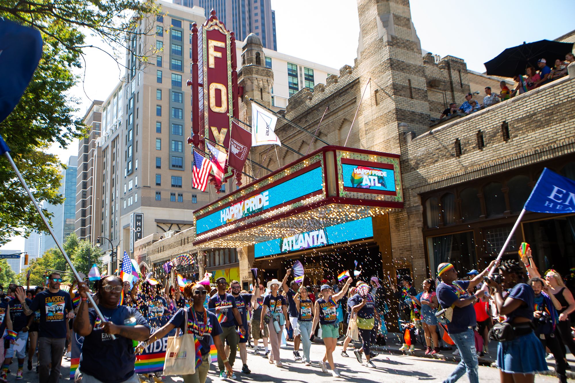 parade walkers in front of the fox theater