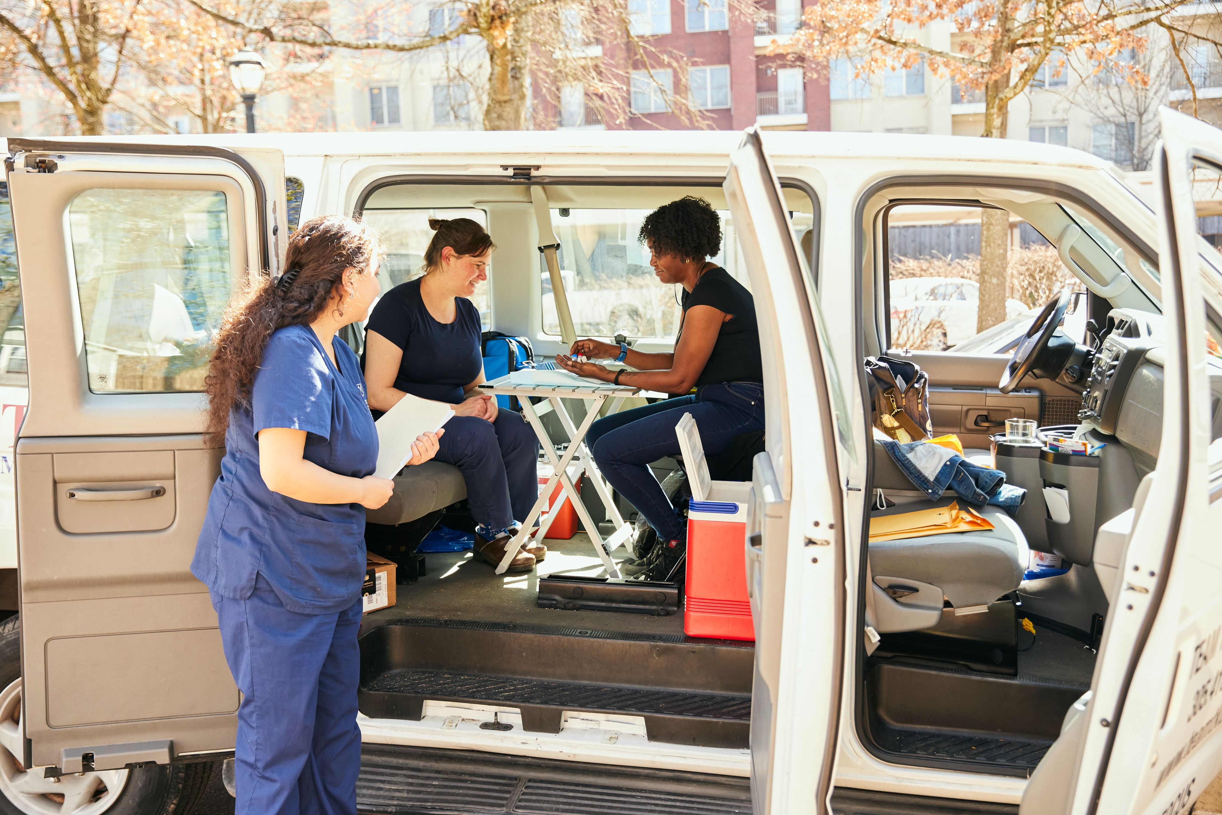 nursing students setting up supplies on the go