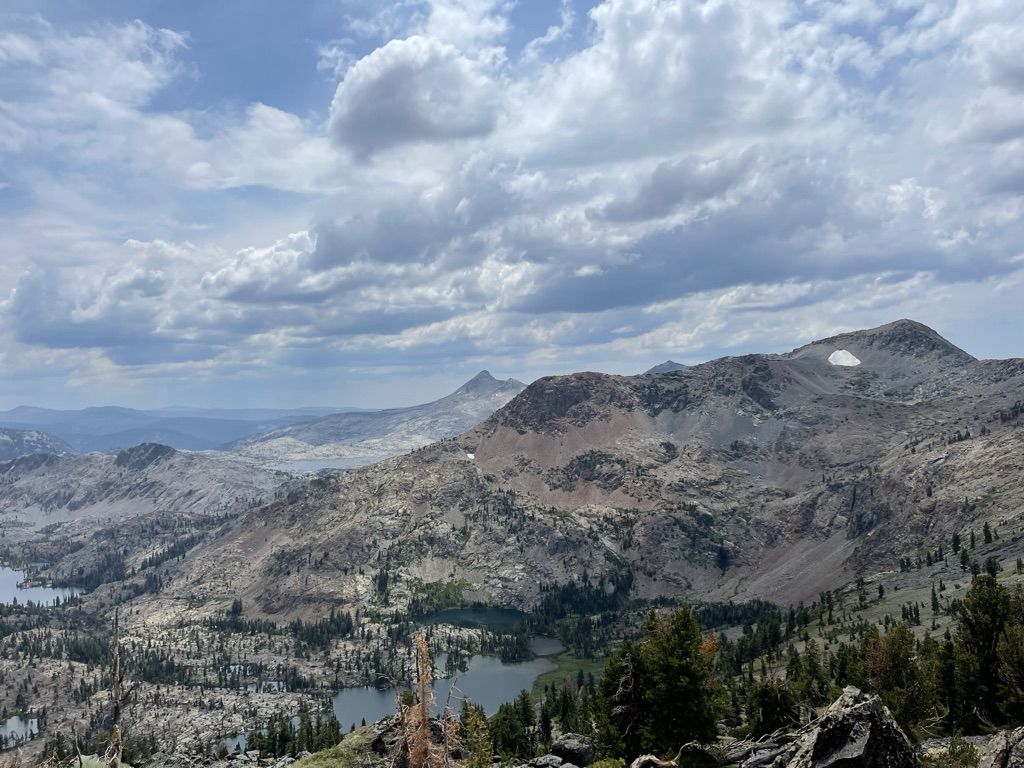 Mountain top scene with large clouds