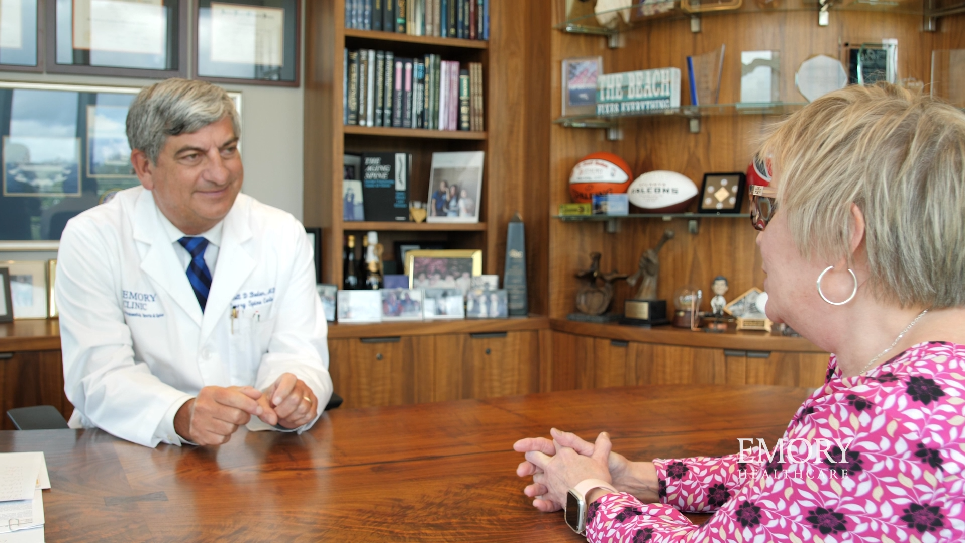 Carol and Dr Boden chatting in his office