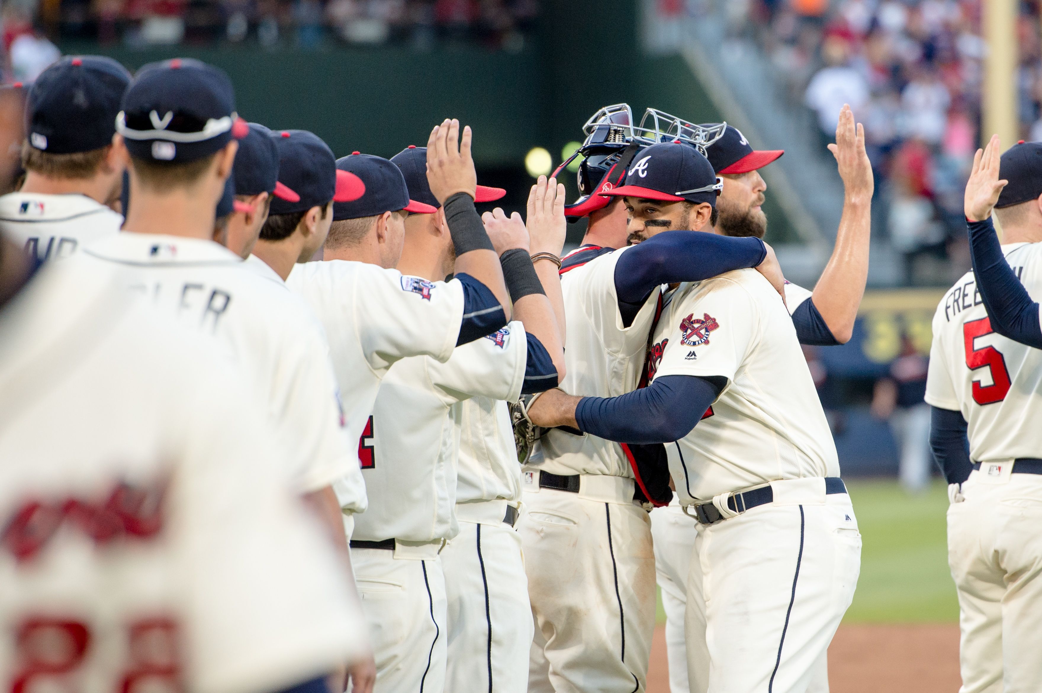 Atlanta Braves high fiving the opposing team after a game