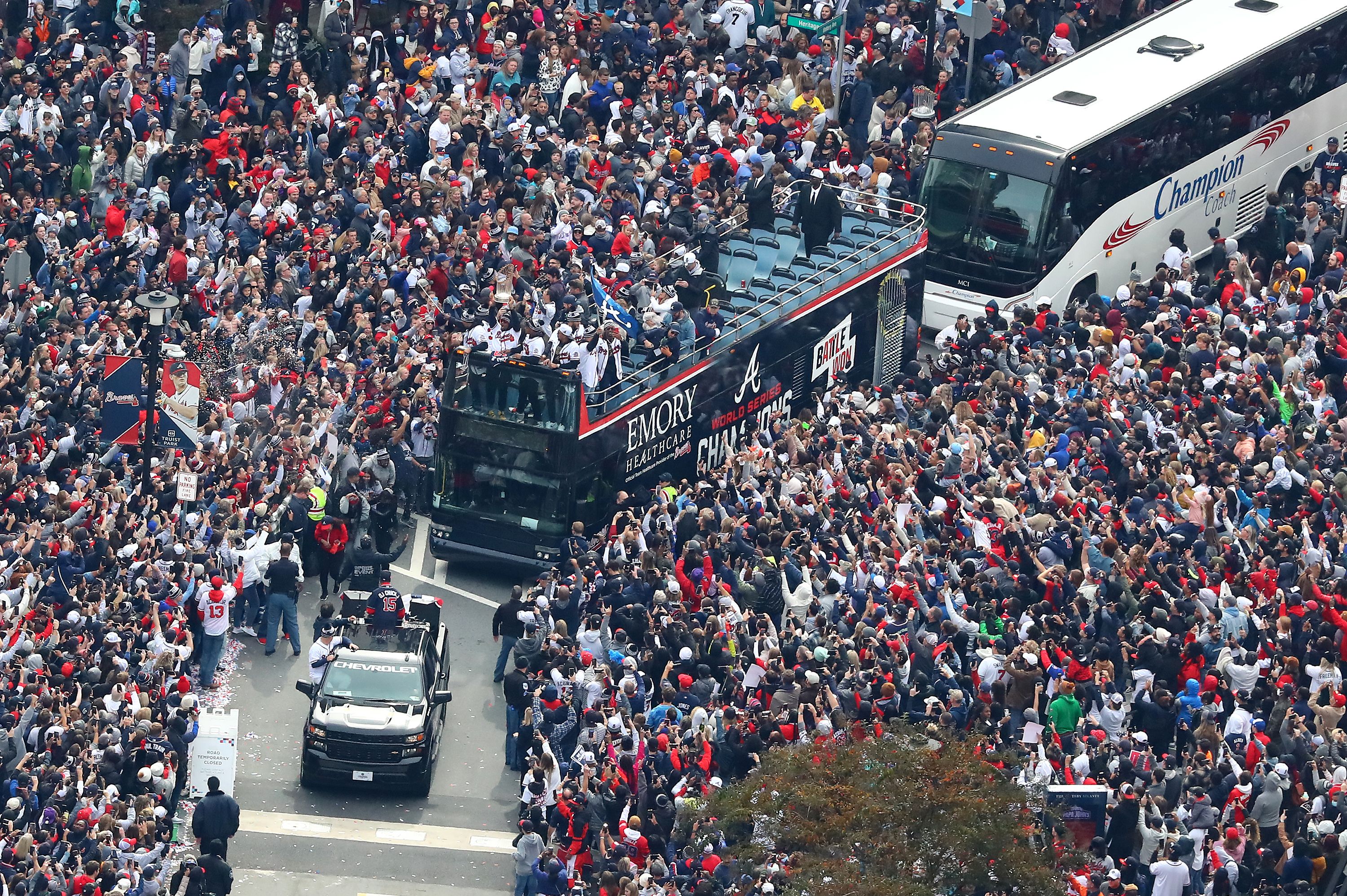 Braves ride Emory bus in parade welcoming them home after World Series win