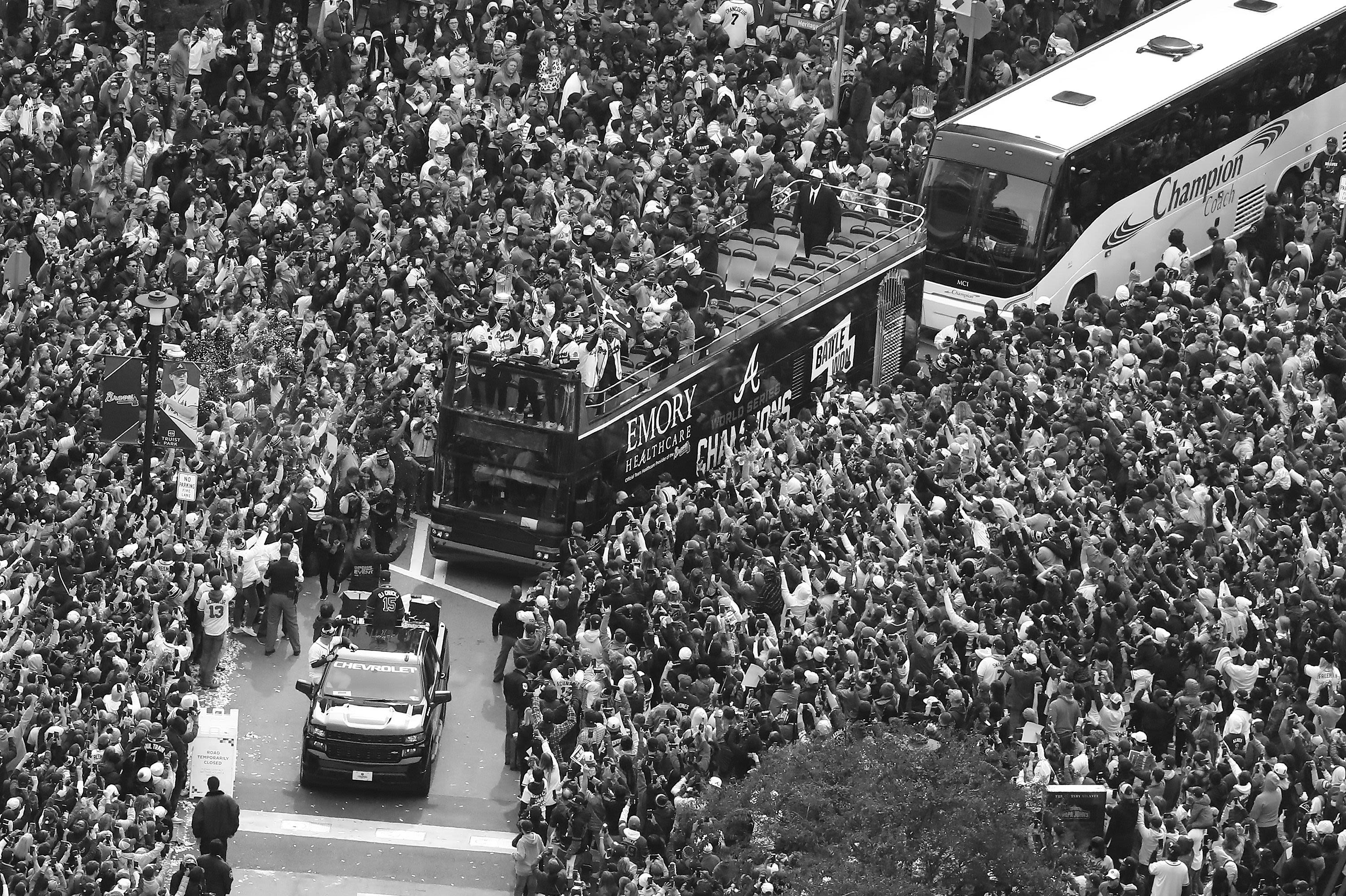 Braves ride Emory bus in parade welcoming them home after World Series win